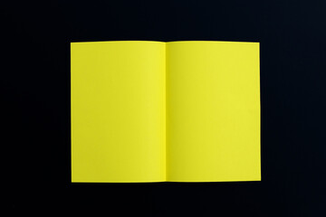 Yellow paper on dark background.