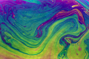 Close up macro, detailed shot of a soap bubble in professional, studio setting with black background behind. Stunning rainbow, colors with purple, green, yellow, green blue stunning, pretty beautiful