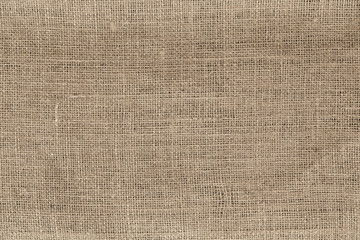 Cream abstract Hessian or sackcloth fabric or hemp sack texture background. Wallpaper of artistic wale linen canvas. Blanket or Curtain of cotton pattern with space for text decoration. 