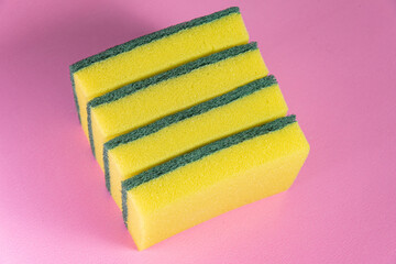 Kitchen sponge on the pink background