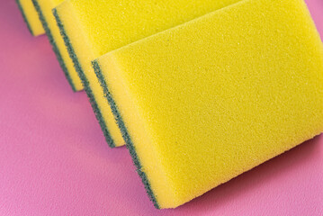 Kitchen sponge on the pink background