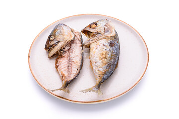 Delicious fried mackerel in a plate on a white background - top view