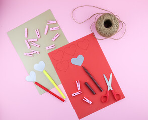 making Valentine's Day decoration with coloured papers