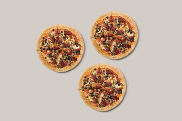 The pizzas are delicious and the ingredients are sausage, bacon and mozzarella on a brown background. can be made of backgrounds, flyers and other forms of advertising,