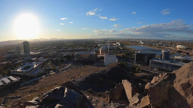 Pan across the developing downtown Tempe skyline to the Tempe Town Lake shoreline, Arizona.