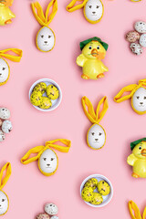 Naklejka premium Decorative Easter eggs, Bunny rabbit and cute yellow chicken on soft pink background. Spring Holiday