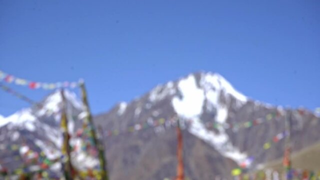 Colorful Prayer Flags Waving At The Kunzum Pass In Spiti Valley, Himachal Pradesh, India On A Sunny Day. rack focus
