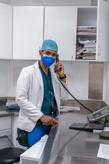 Fototapeta premium doctor talking on the phone in hospital