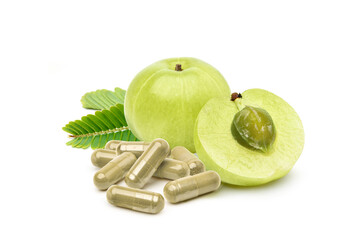 Amla (Indian gooseberry) capsules with fruits isolated on white background.