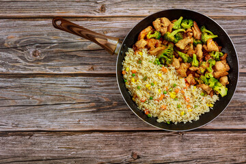 Fried sweet ans sour chicken with steamed rice.