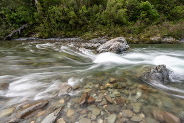 Rapid section of the Te Hoiere/Pelorus River flowing over rocks and through forest. Pelorus Bridge, Marlborough, New Zealand.