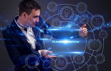 Business, Technology, Internet and network concept. Young businessman working on a virtual screen of the future and sees the inscription: Transformation