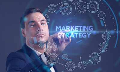 Business, Technology, Internet and network concept. Young businessman working on a virtual screen of the future and sees the inscription: Marketing strategy