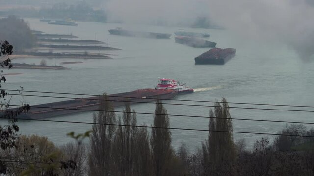 Fluvial transportation: Barges transporting goods on the Rhein river in Germany