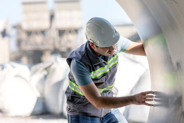 The inspector is inspection to the steel materials in the construction site.