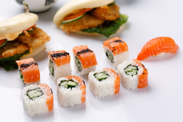 Philadelphia roll with cucumberon and appetizing fresh sushi white background. Sushi menu. Japanese food.