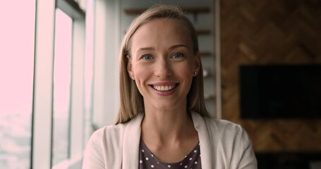 Smiling pleasant blonde woman making hello gesture, starting online web camera call conversation, communicating with colleagues or passing job interview. Beautiful female blogger recording video.