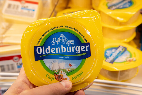 Tyumen, Russia-January 31, 2021: oldenburger cheese. Oldenburger is a trademark of the DMK Group. on the shelves of a hypermarket