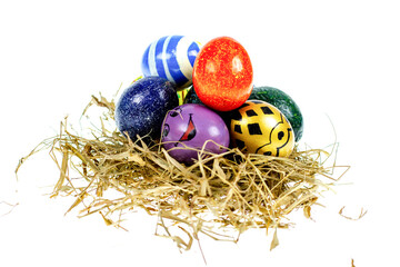 Fototapeta na wymiar Easter eggs in nest on white background