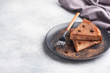 Slice of chocolate curd casserole on a plate, a portion piece of cake with chocolate and coffee....