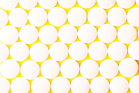 Image of a drug, pill, or remedy. On yellow background paper.