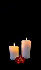 Fototapeta na wymiar Candle on a black background, postcard, Flat Lai on death and funeral