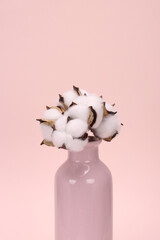 a bunch of cotton balls on a pink background