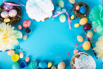 Colorful background with Easter eggs on blue background. Happy Easter concept. Can be used as poster, background, holiday card. Flat lay, top view, copy space. Studio Photo