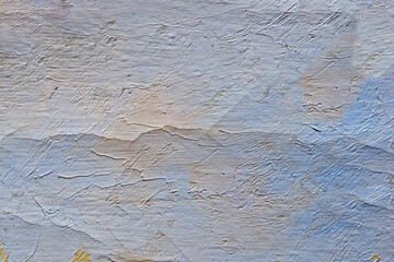 A fragment of a concrete wall casually covered with oil paint