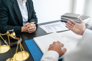 Lawyer discuss the contract and legal document agreement in office. Law and legal concept.