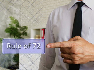 Business concept about Rule of 72 with phrase on the piece of paper.