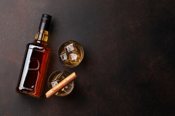 Scotch whiskey bottle, glasses and cigar © Evgeny Karandaev