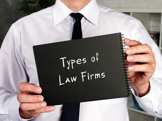 Business concept meaning Types of Law Firms with sign on the page.