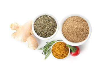 Bowls with different spices on white background