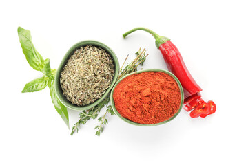 Bowls with different spices on white background