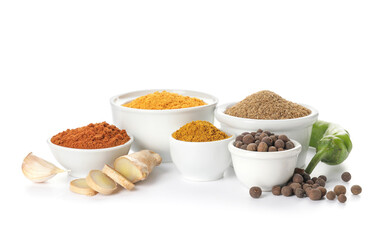 Bowls with different spices on white background