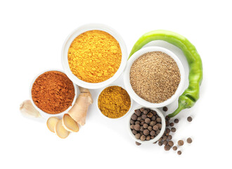 Bowls with different spices on white background