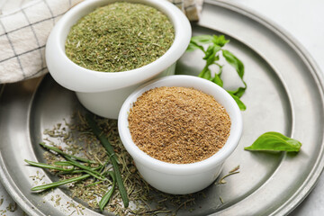 Tray with different spices and herbs on light background, closeup