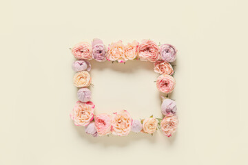 Frame made of beautiful flowers on light background