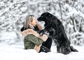 Beautiful woman play with a dog,