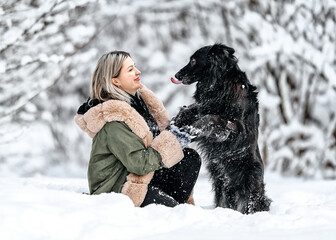 Beautiful woman play with a dog,