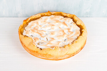 Pear pie with cream, homemade delicious pastries, dessert for breakfast, on a white table. Copy space.