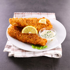 crispy breaded fish fillet and lemon