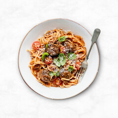 Spaghetti meatball with marinara tomato sauce topped with parmesan and basil food photography