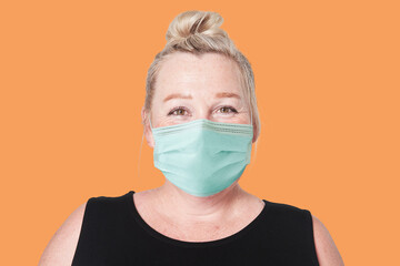 Mature woman wearing mask for Covid-19 prevention campaign