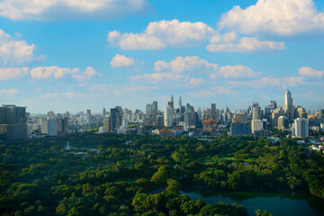 Obraz premium Lumpinee garden and Sathorn building in Bangkok, Thailand