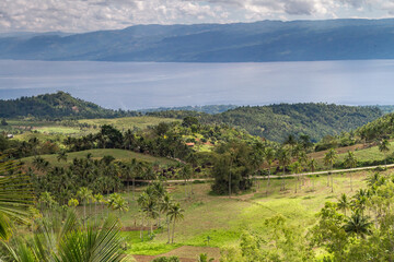 Fototapeta na wymiar Slopes of Mount Talinis, Negros Across the Strait of the Sea View of Cebu Island