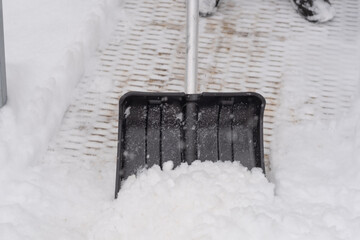 shovel with snow. Snow removal. Heavy snowfall. snow harvesting work. Snow cleaning.