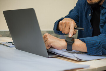 Fototapeta premium people use smart watch technology in daily lifestyle , Hand touch on smart watch