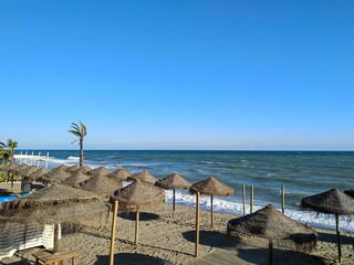 beach with umbrellas and chairs